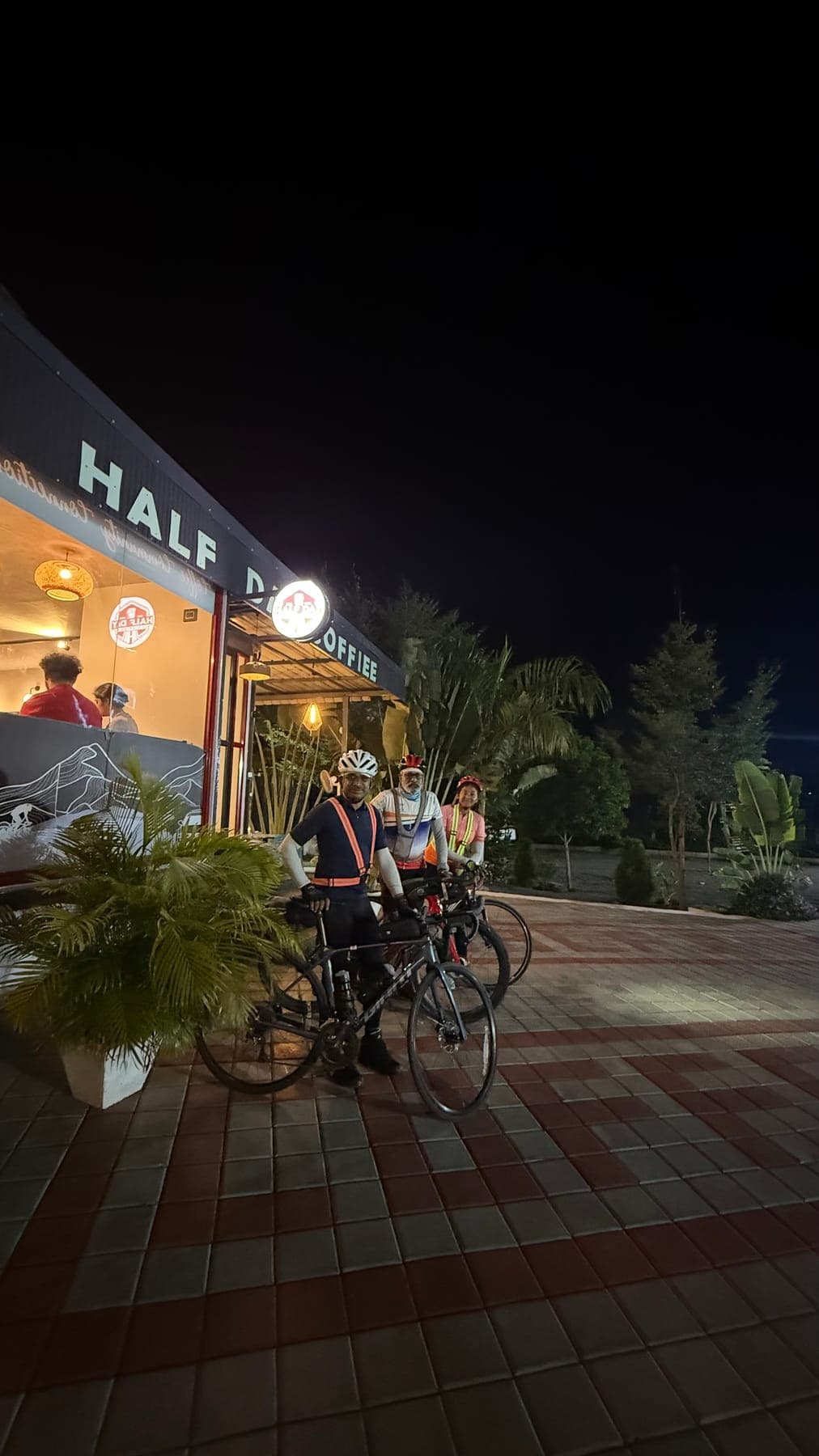 Cyclist at HalfDay Coffiee at night