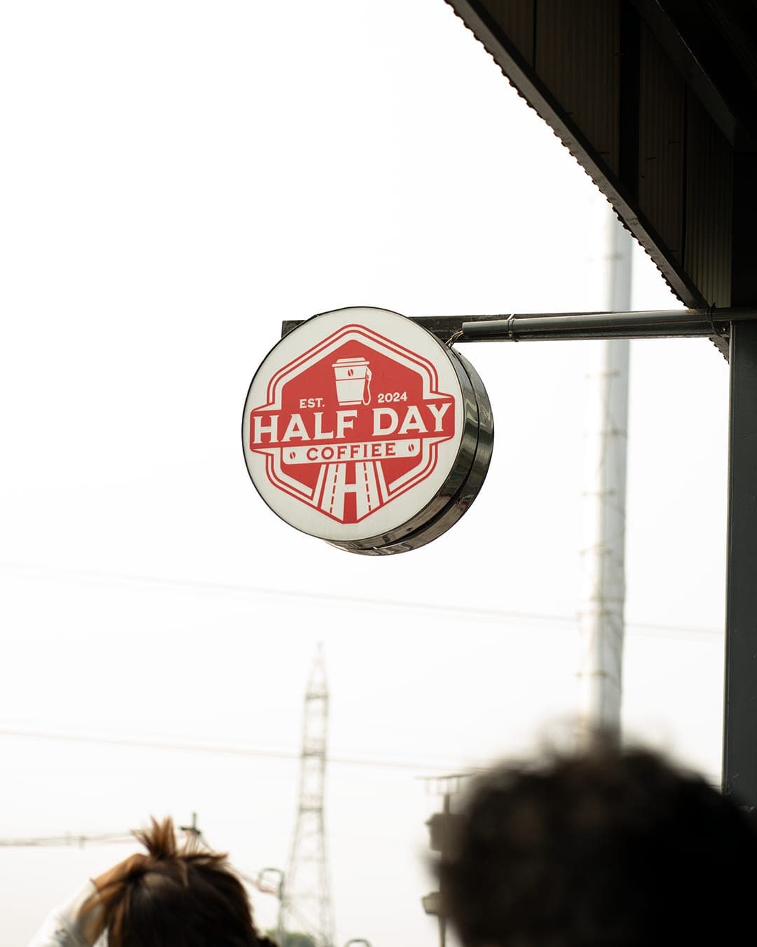 The HalfDay Coffiee hanging sign