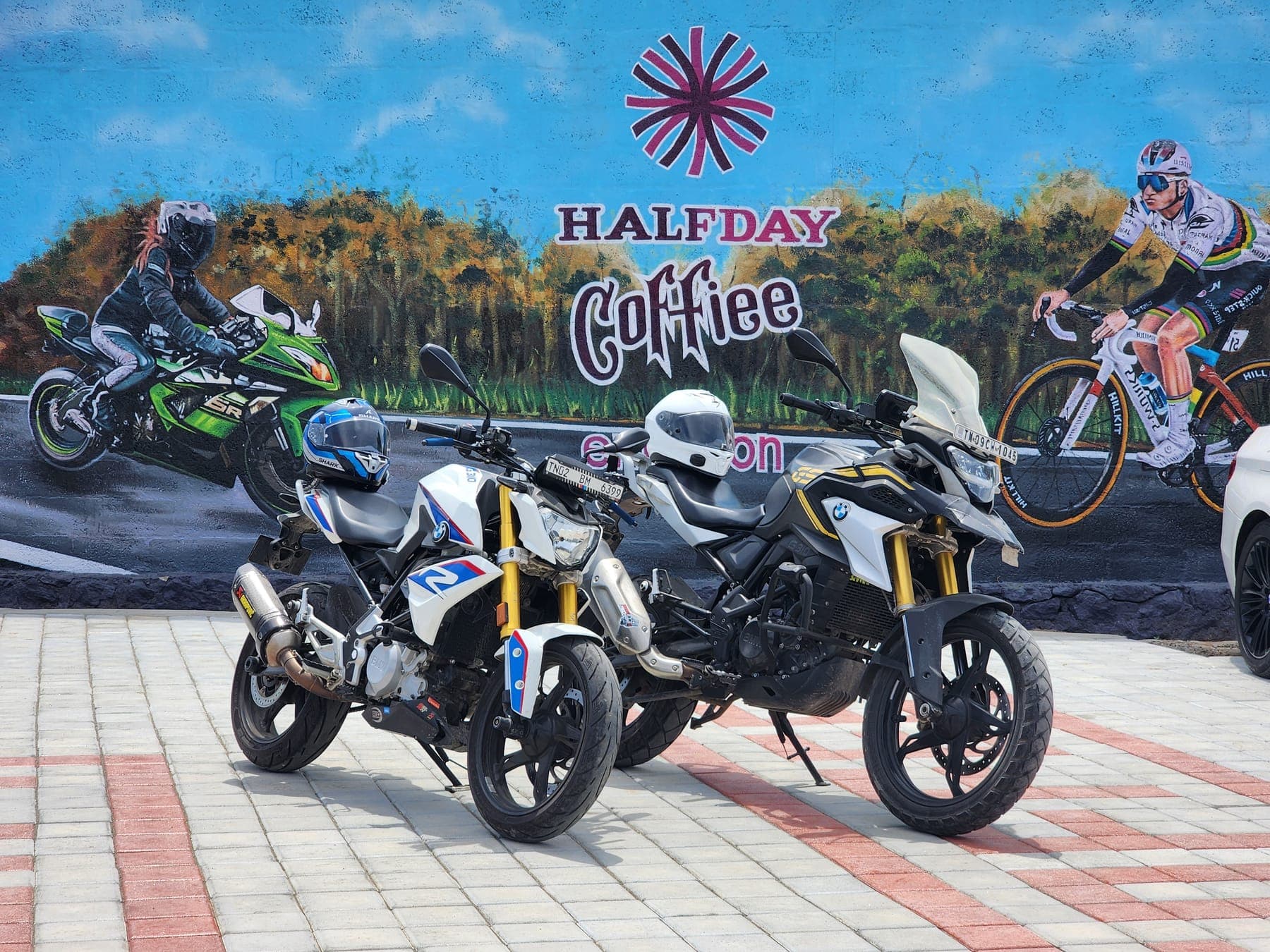 Motorcycles beneath the HalfDay banner