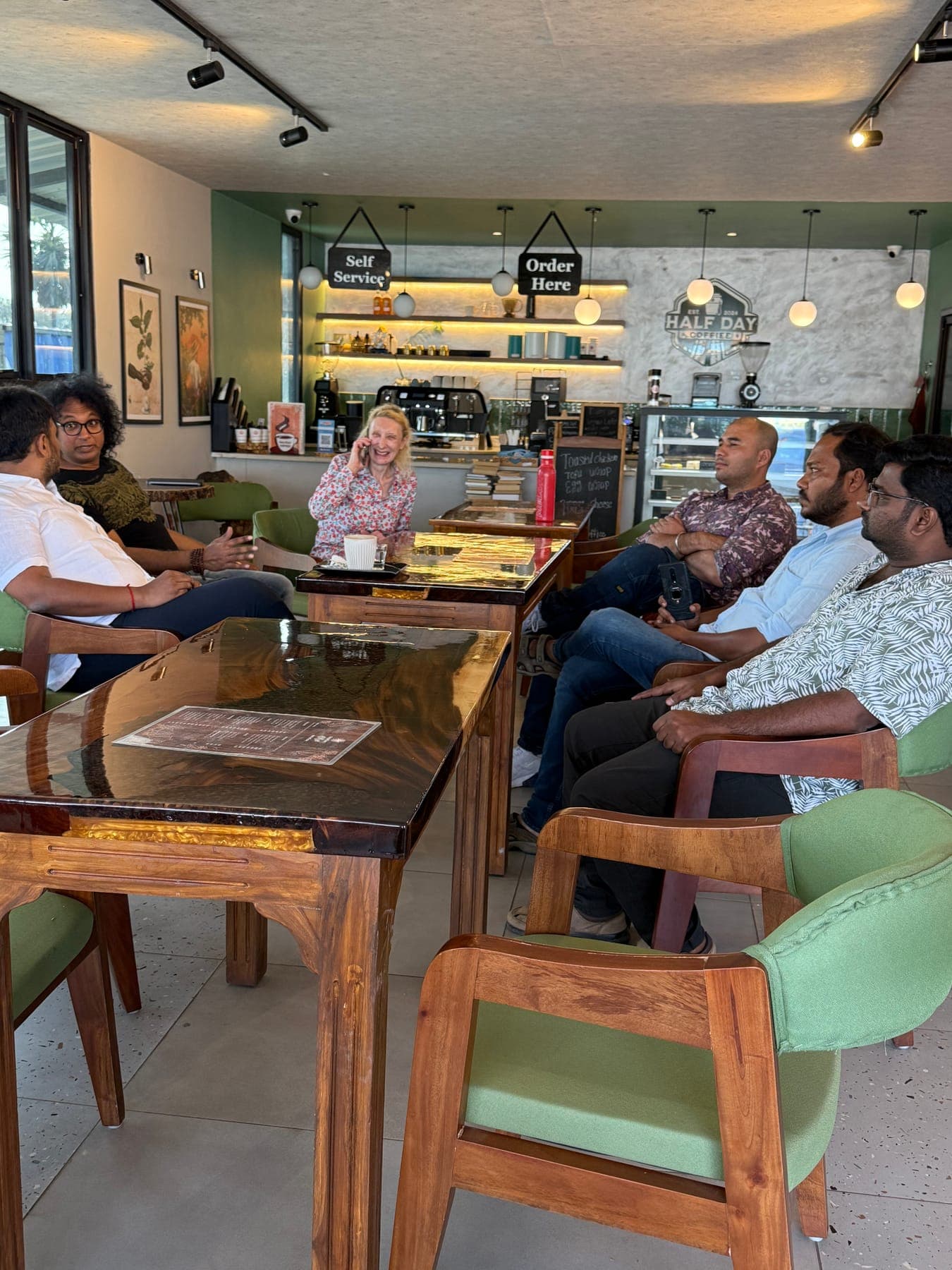 People sharing a table at the cafe