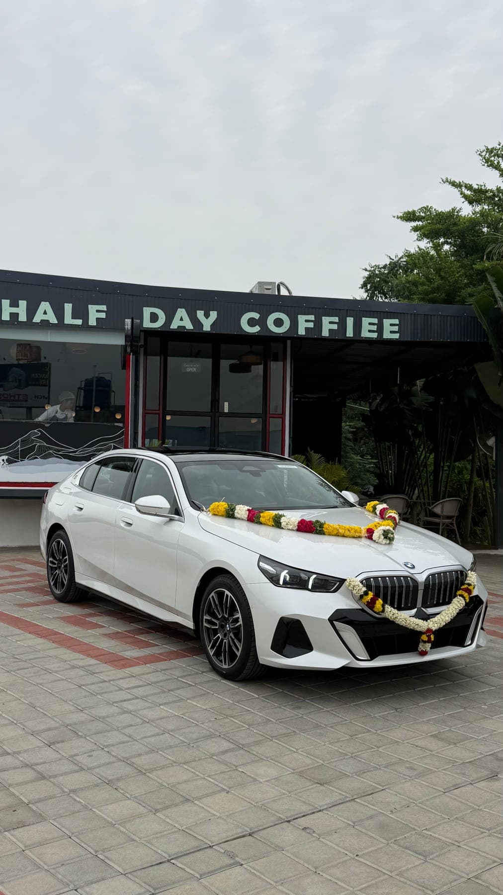 White BMW wedding car at the cafe