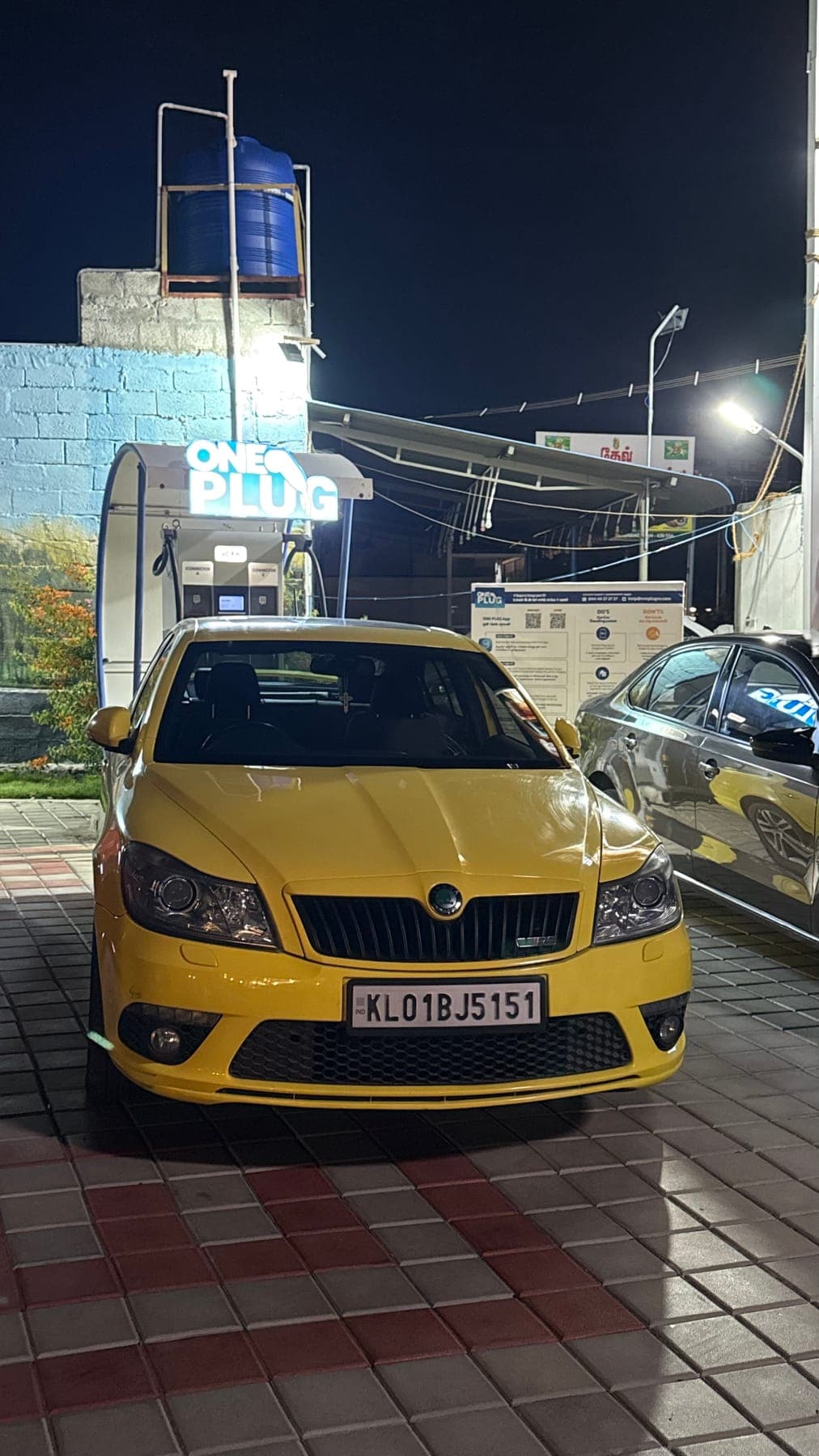 Yellow car on the highway at night